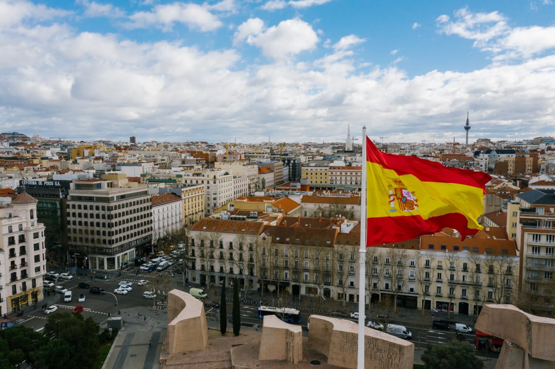 Spanish national flag against cityscape